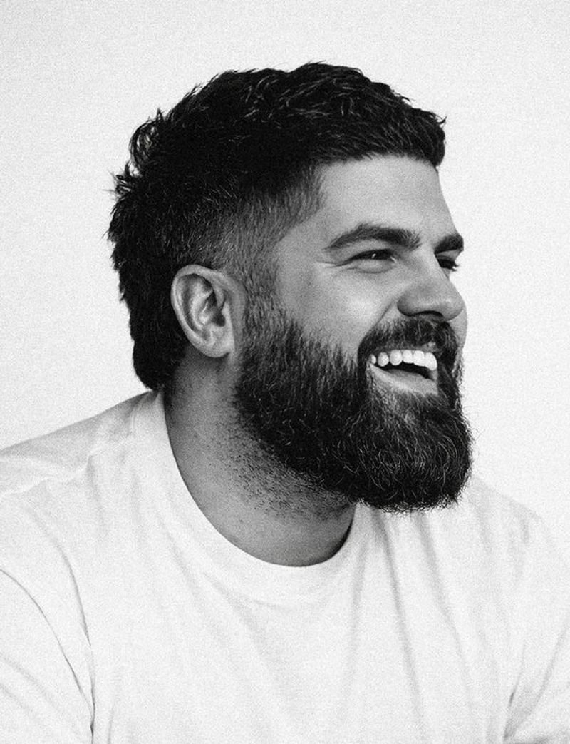 James Hazlett-Beard laughing, black and white portrait